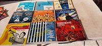 Overview of all 10 vintage 78 RPM records with original cardboard sleeves, colorful vintage artwork, arranged on a flat surface.