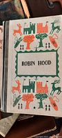 Cover of the vintage Robin Hood hardcover story book with colorful illustrations and title on front.