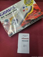 View of the original sealed box for Gravis PC Game Pad and Control Pad, showing box graphics and product name.