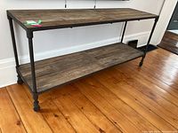 Full frontal view of two-tier console table showing overall design and dimensions.