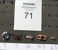 Full set of five rings displayed on black foam with size labels visible below each ring: 7,7,10,10.5,6.5.