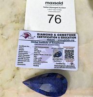 Certificate of authenticity from Global Institute of Excellence for a natural blue sapphire weighing 197 carats.