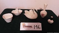 Full view of all five Lenox china pieces displayed on a black tablecloth.