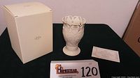 Overall view of the Lenox vase with original box and certificate of authenticity shown on a table.