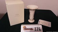 Vase displayed with original Lenox box and certificate of authenticity on a black surface.