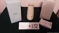 Full view of Lenox vase with original box, certificate, and paperwork placed beside it.