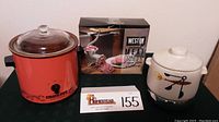 Weston #10 manual meat grinder in box, Rival Crock Pot slow cooker, West Bend bean cooker crock pot