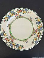 Top view showing the floral and scalloped design on the front of the Wedgwood plate.