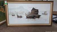 Full frontal view of painting showing multiple junks on water and city skyline in background