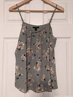 Sage green floral spaghetti strap top by RW&Co, size medium, floral print and scalloped neckline detail