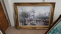 Full view of signed oil painting in ornate gold frame showing vintage street scene with carriages and people in historic clothing.
