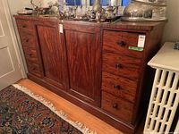 Front left angle view showing four drawers on left side and two central doors