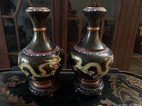 Front view of both vases on stands