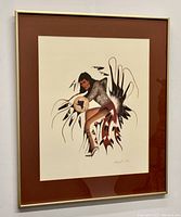 Full view of framed lithograph print featuring Native American brave figure, brown mat, gold frame.