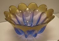 Front side view of the Walther German art glass bowl showing petal-shaped edges with violet-blue and gold hues.