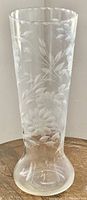 Full view of the etched glass vase with visible floral patterns, showing overall shape and size.