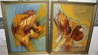 Pair of framed Mid Century Modernist abstract paintings on board with textured brushstrokes in warm earth tones and blue background.