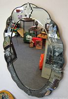 Full view of the Venetian hall mirror showing oval shape and etched floral designs