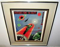 Straight-on view of framed poster against white background showing full artwork, mat and frame