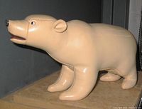 Frontal view of the leather polar bear figure showing detailed head, ears, and front legs.