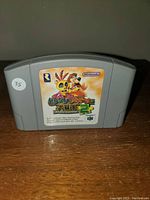 Front view of the Banjo & Kazooie Japanese Nintendo 64 cartridge showing label with characters and Japanese text, Rare and Nintendo logos.