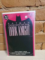 Front cover photo of Batman Legends Of The Dark Knight #1 comic book with title and silhouette of Batman.