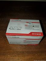 Box of the HD camera with printed specifications and brand labeling in white and red color scheme.