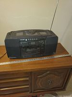 Front view of Sharp ghetto blaster showing cassette decks, buttons, speakers and power cord