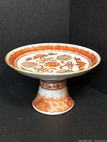 Pair of porcelain tazzas, side view showing pedestal base and bowl