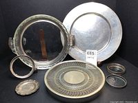Group shot of all pieces showing charger, server with coasters and tea bag dish