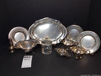 Group of all 12 silver serving pieces
