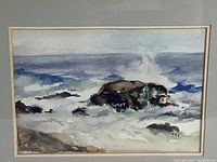 Close view of watercolor artwork showing surf, rocks, and waves with signature TMH at bottom right.