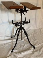 Front view of entire book stand showing dual shelves, tray and base