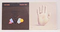 Two vinyl LP record albums: Com Truise "Galactic Melt" with black cover and geometric shapes, and Chet Faker "Built On Glass" showing a sculpted hand image.