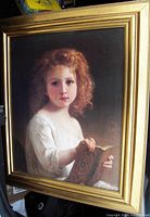 Front view of the gilt wood framed art print showing a young girl reading a book in Victorian style clothing.
