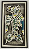 Full view of framed Haida killer whale wooden wall art piece with black frame and white matting.