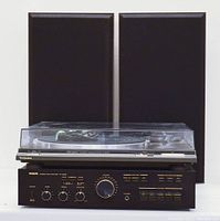 Front view of complete sound system setup with two J 500 speakers, Technics turntable on top of Philips amplifier.