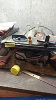 Front view of Craftsman 8 inch table saw showing metal construction, miter gauge, and controls on front panel.