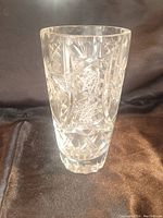 Front view of crystal pinwheel vase showing detailed star and pinwheel cuts on clear crystal.