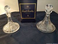 Photo showing two small crystal decanters with Royal Brierley box in background.