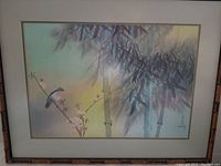 Full view of the "Spring Bamboo" artwork showing bamboo stalks, a small bird, and flowering branches in soft colors framed in bamboo-patterned wood.