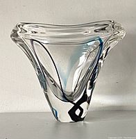 Front view showing triangular form and color trails