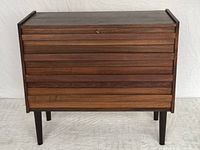 Front view of the dresser showing overall design, wood grain, and condition