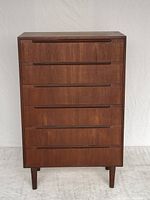 Full front view of dresser showing six drawers, legs and overall finish