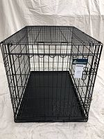 Front angle view of the black metal wire dog crate showing door and latch detail.