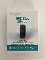 Front view of the TP-Link Archer T2U AC600 Wireless Dual Band USB Adapter retail box showing product name and product image