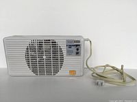 Front view of the Suncourt Equalizer EQ2 vent booster showing fan grill, control panel with speed settings and power cord.