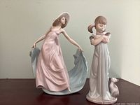 Two figurines side by side on tabletop