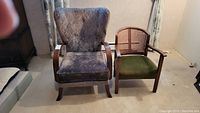 Two vintage chairs side by side, one large with brocade upholstery, one smaller cane and green velvet seat chair.