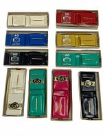 Full set of 10 vintage photo and pass holders showing color variety and packaging.